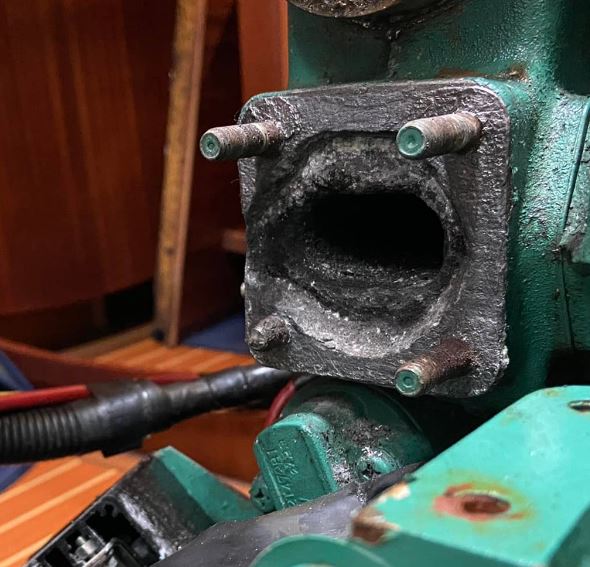 Image showing serious corrosion on a Volvo Penta 2020 heat exchanger flange  for connection to the exhaust elbow.