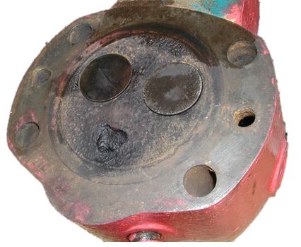 Image showing a SABB type G cylinder head with extreme corrosion on the valve seats.